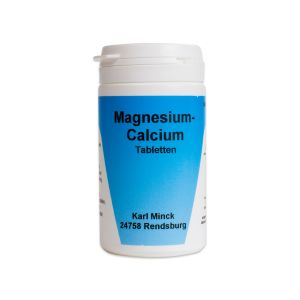 Magensium Calcium Tabletten in einer weißen Tablettendose mit blauem Etikett