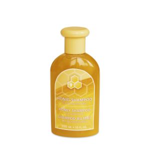 Honig Shampoo in einer transparenten Flasche mit gelbem Deckel