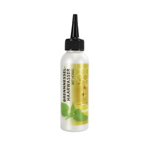 Brennessel Haarwasser mit Honig in einer weißen Flasche mit schwarzem Dosier-Verschluss