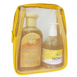 Honig Creme Seife in einer Spenderflasche und Honig Shampoo in einem gelben Beutel