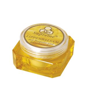 ApiSupreme Lippenbalsam mit Propolis und Bienenwachs in goldener Dose mit einem runden durchsichtigen Deckel