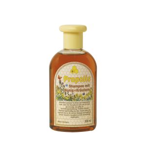 Propolis Shampoo mit Honig + Kräutern in einer durchsichtigen Flasche mit beigefarbenem Deckel