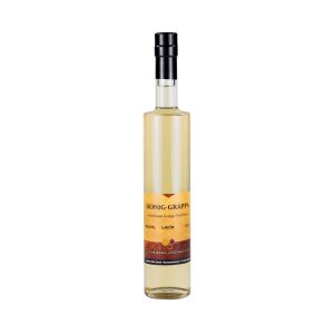 Honig Grappa in einer weißen Glasflasche 